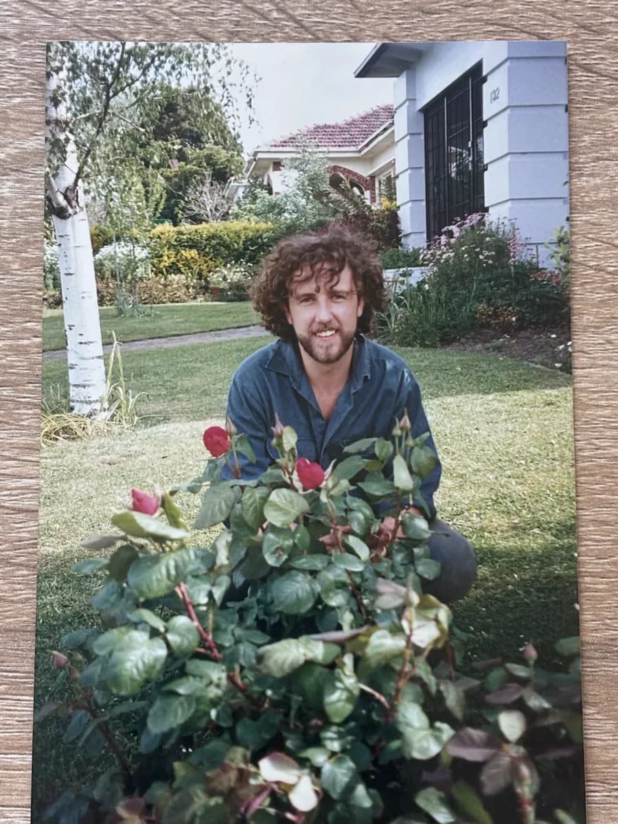 Young Anthony Bennett tending roses in a Camberwell garden in the early days of ABS Horticulture