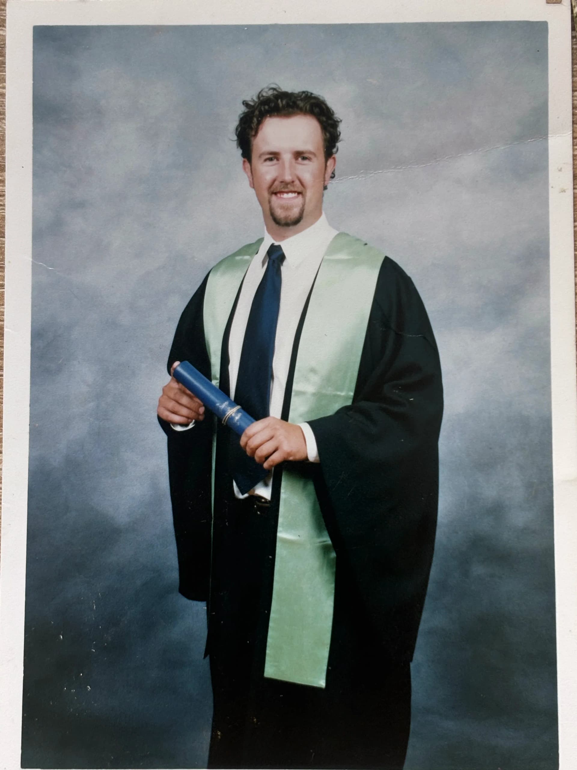 Anthony Bennett at his graduation from the University of Melbourne, Burnley Horticultural College, holding his diploma